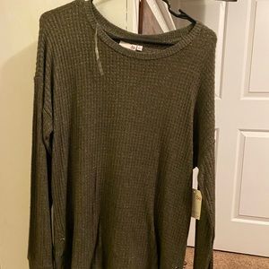 So brand. Size Large. Green sweater.